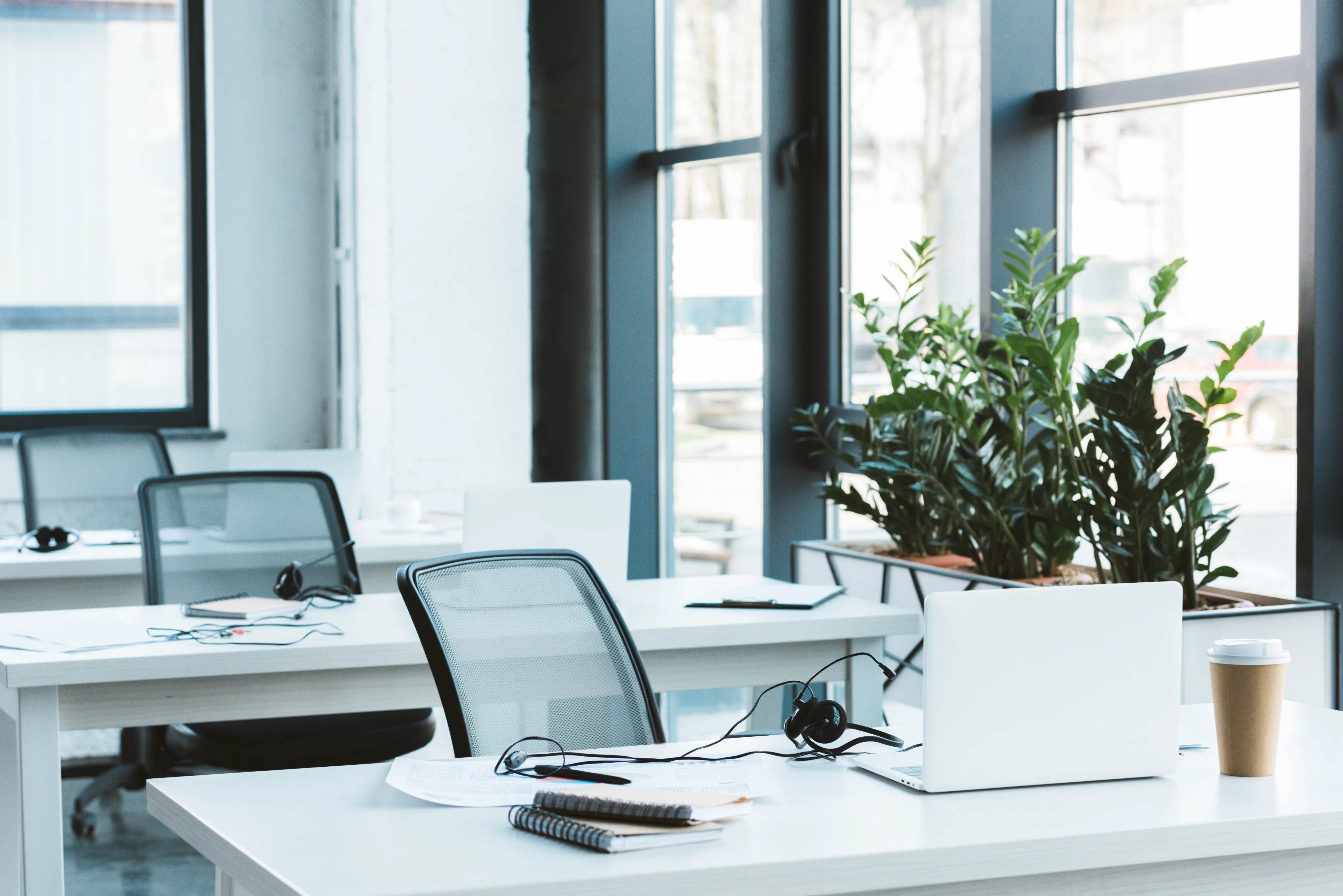 Tidy, organized desks in a clean office workspace