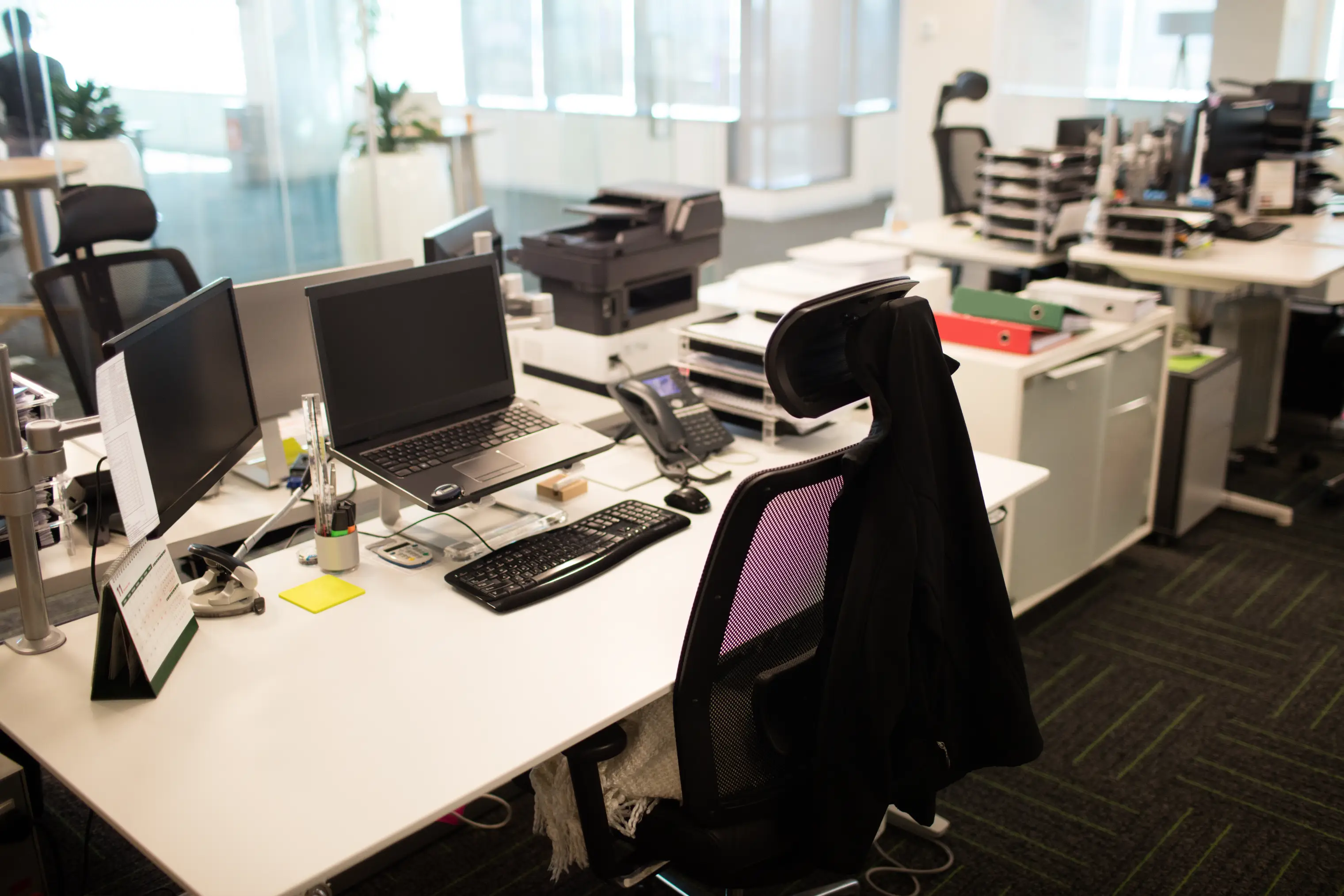 Bright, clean modern office with tidy workstations